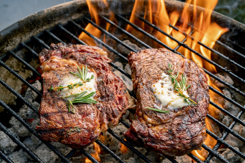 two ribeyes on grill