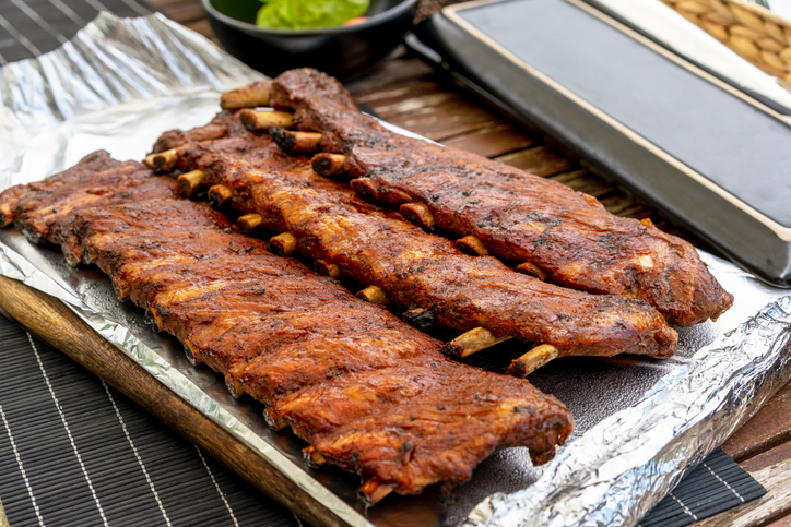Juicy BBQ pork ribs on foil