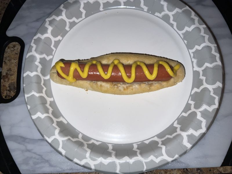 eating olive garden breadsticks and hot dog